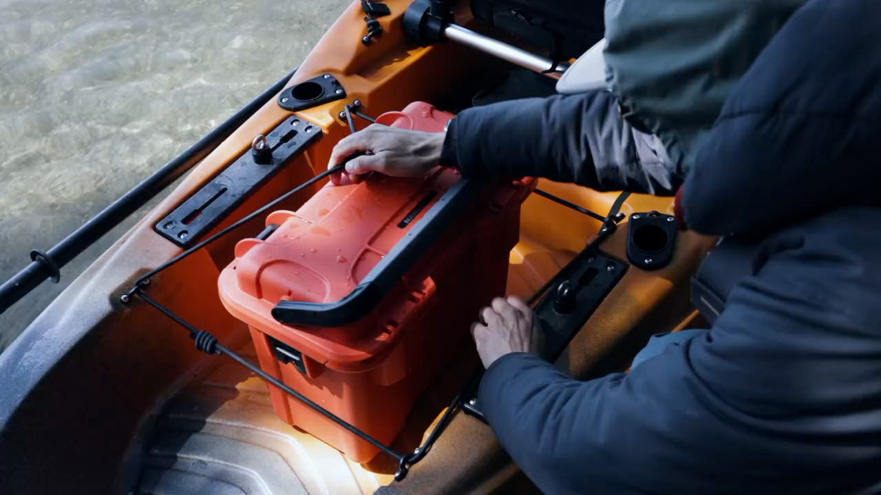 NANUK Trail Case being tied up in a Kayak