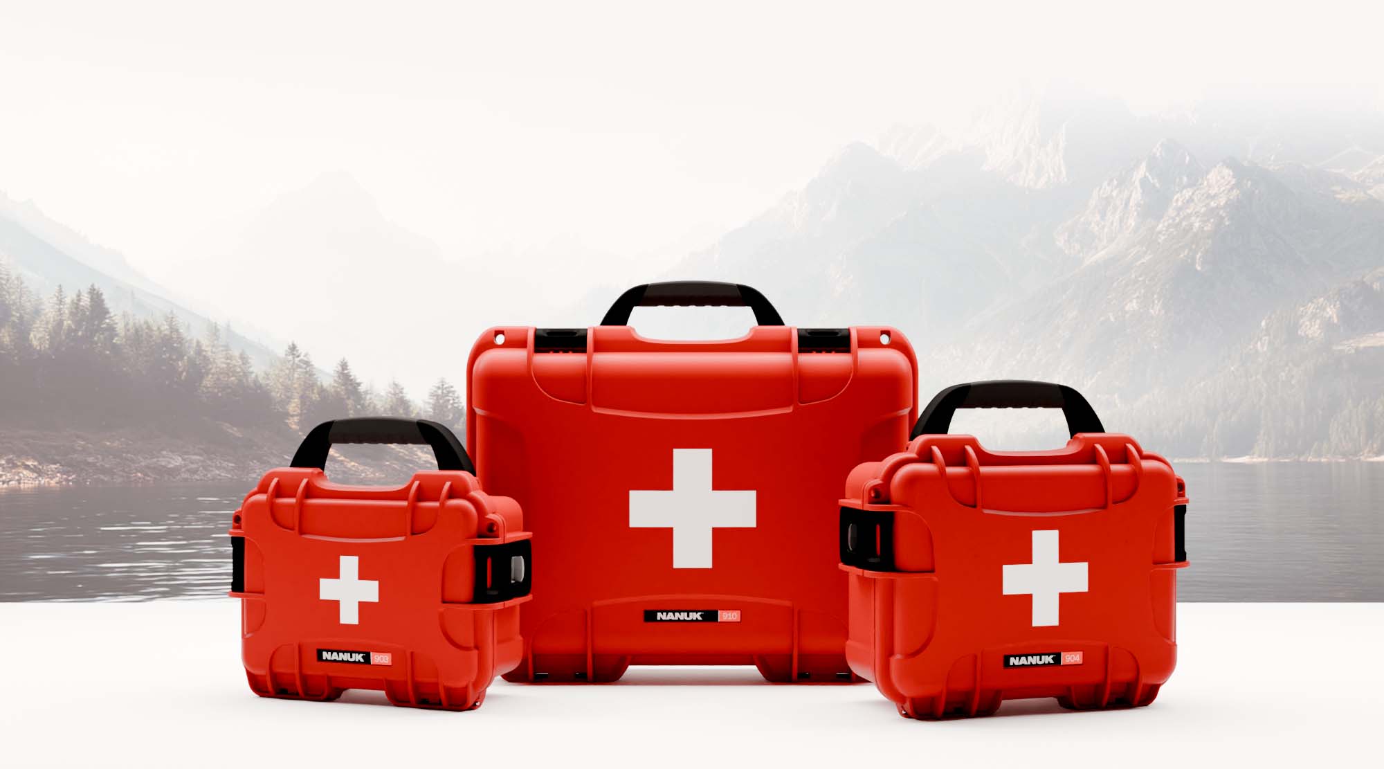 Minimalist studio shot of three different-sized red NANUK First Aid Cases placed in front of a mountain scene.