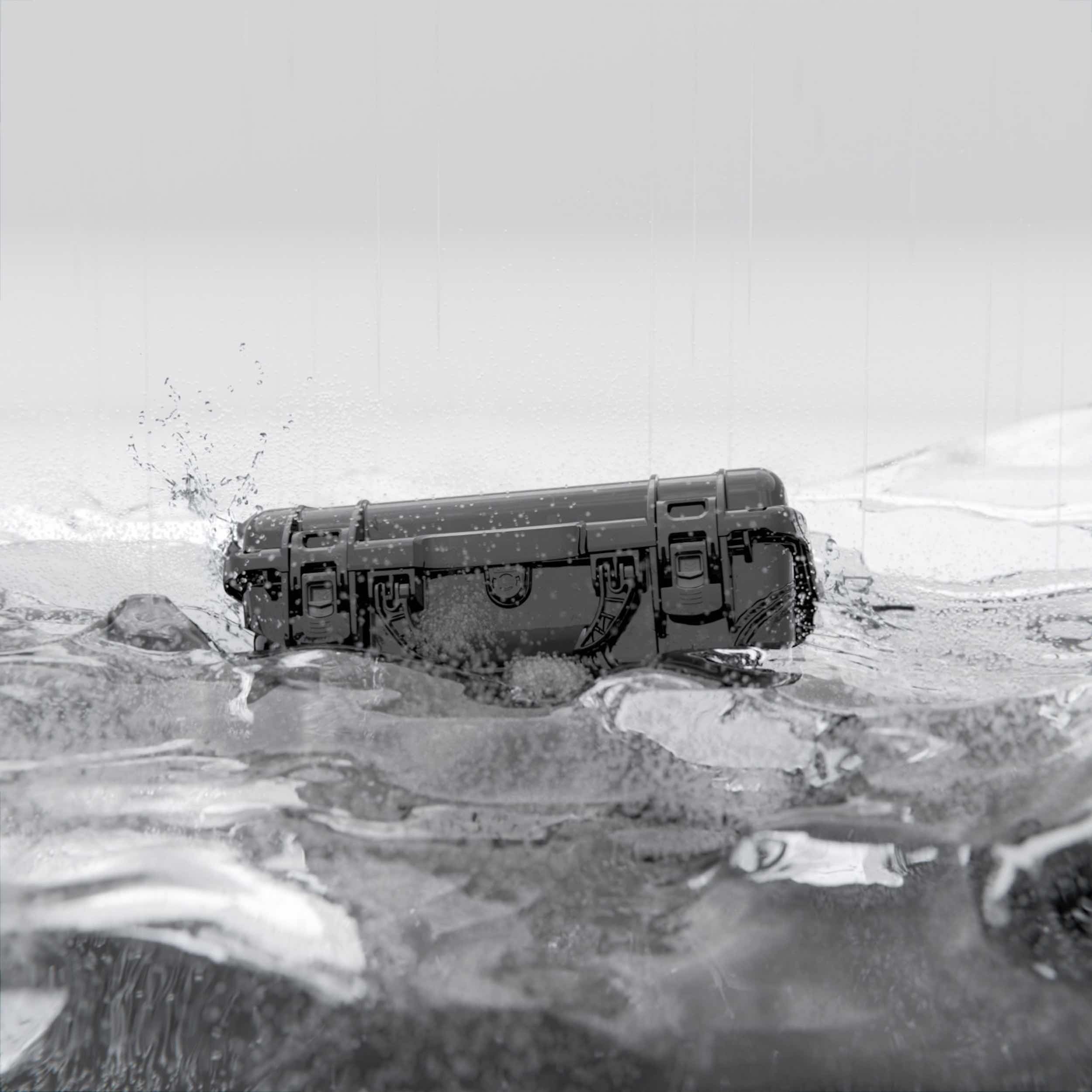 "Black NANUK hard case in water, demonstrating waterproof and durable protection for gear