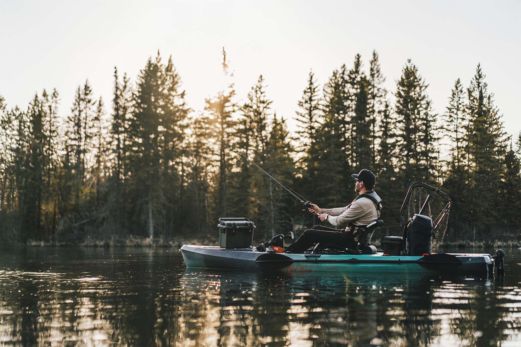 Men Fishing on a lake with his NANUK Trail Gear Cases